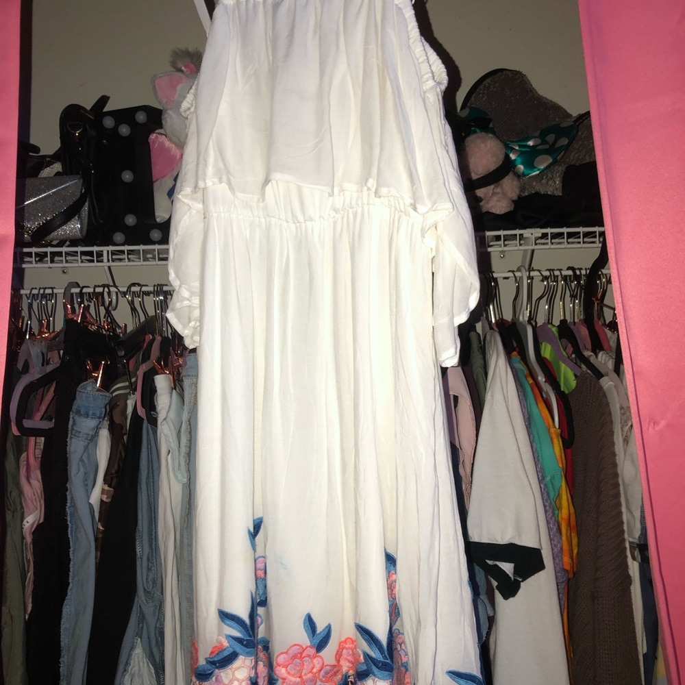White dress and flower design at the bottom